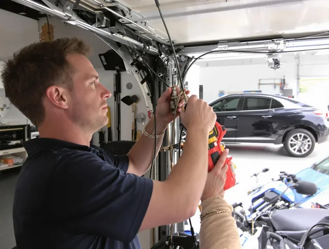 Palm Beach Gardens Garage Door Repair safety certified technician performing cable replacement in Palm Beach Gardens