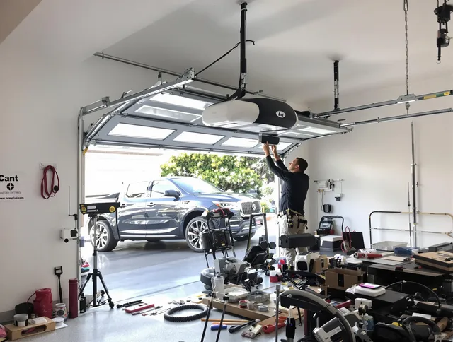 Palm Beach Gardens Garage Door Repair specialist installing smart garage door opener system in Palm Beach Gardens home