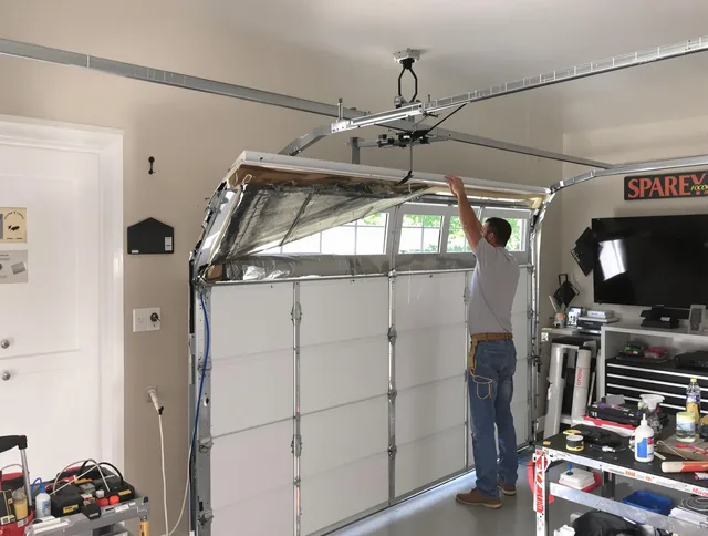 Garage door section replacement by Palm Beach Gardens Garage Door Repair in Palm Beach Gardens